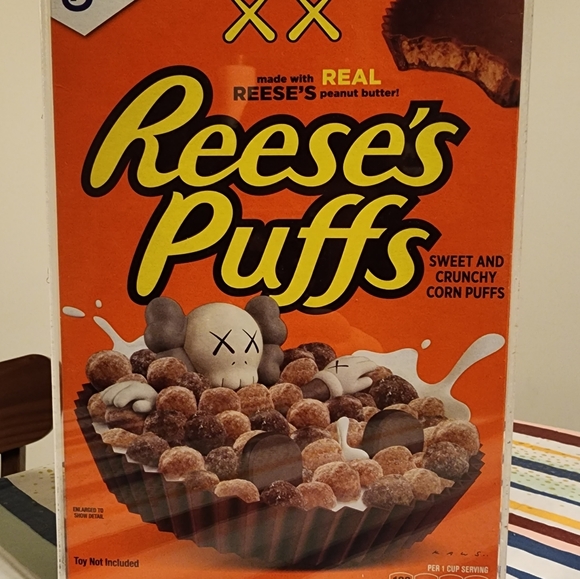 Reese's Puffs - KAWS Cereal In Display Case - Picture 2 of 3